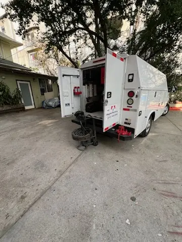 Magnet Plumbing service vehicle on-site for Grease Trap Cleaning in Country Villa Estates